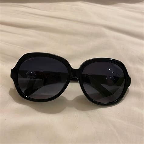 chanel sunglasses pearl on side.